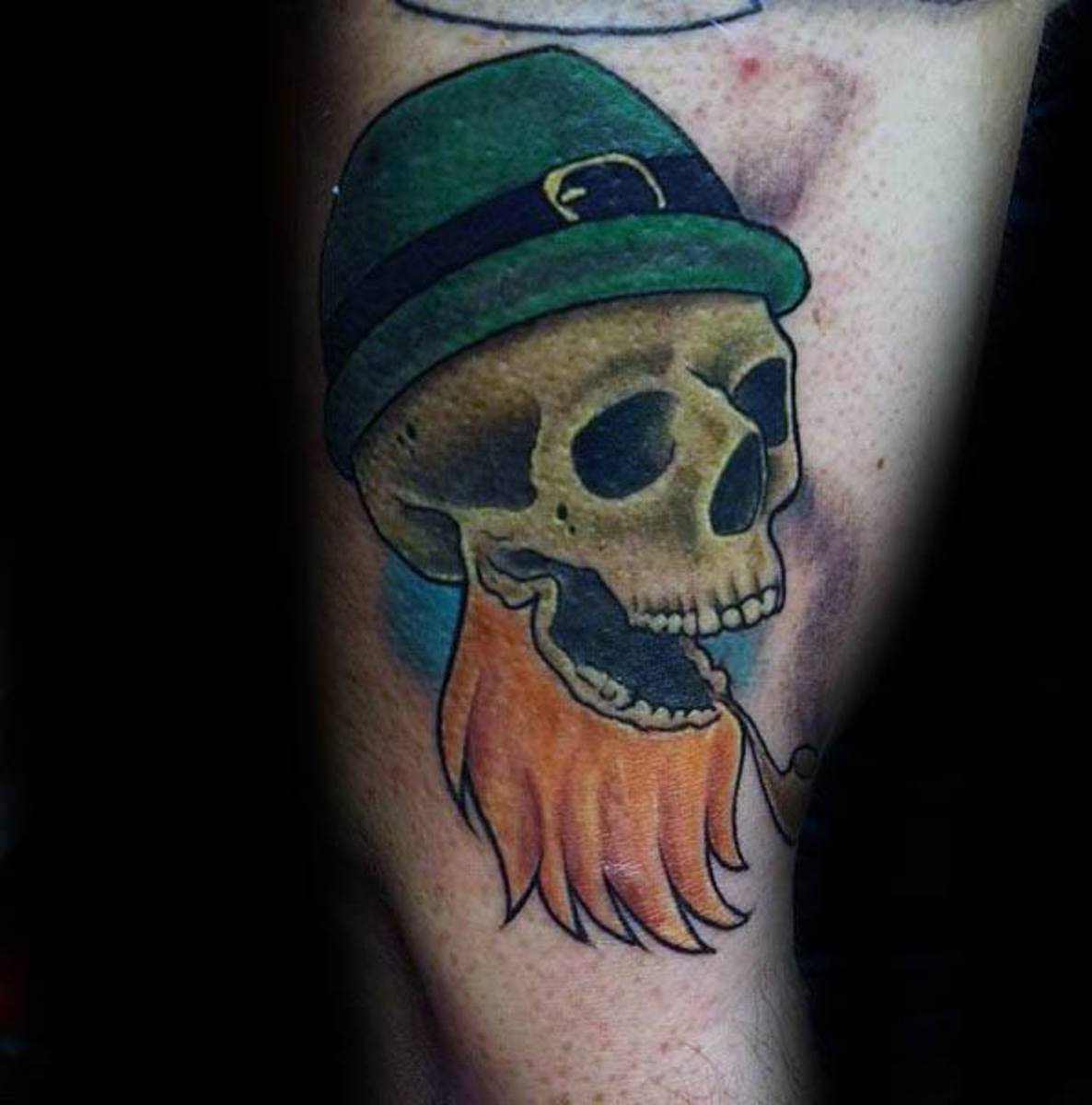 arm-skull-leprechaun-tattoo-design-on-man