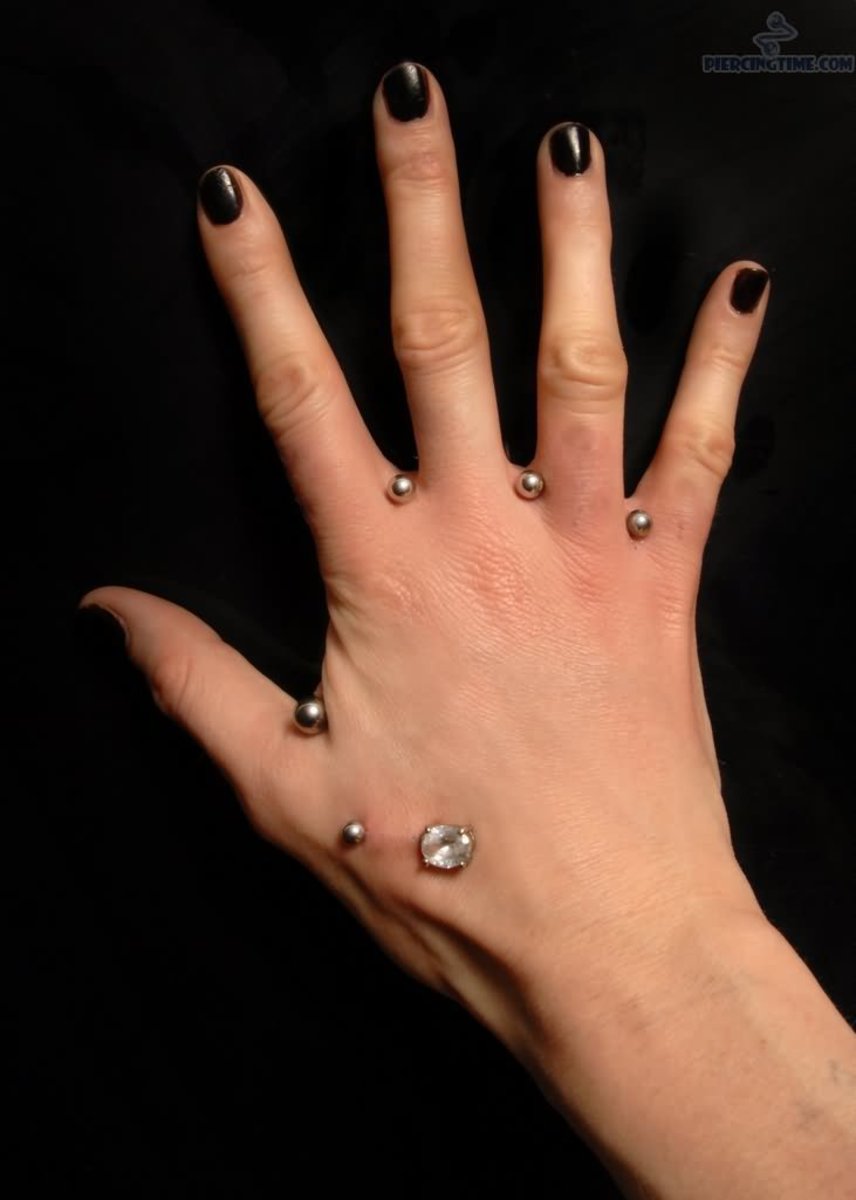 Girl-With-Hand-Web-Piercings-With-Silver-Studs