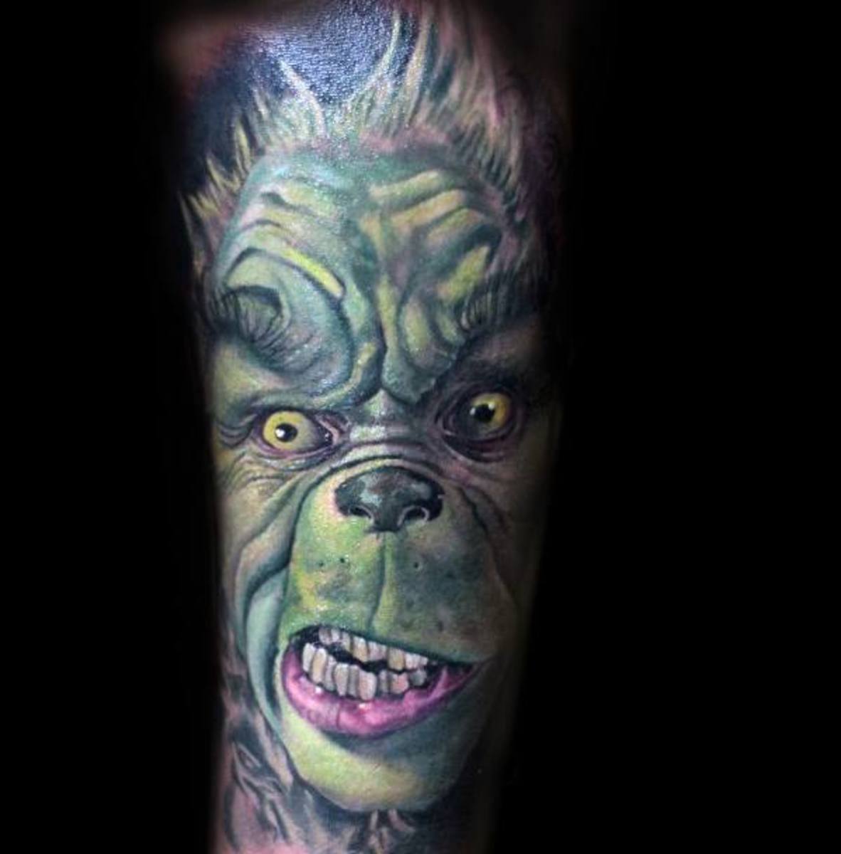 male-with-cool-grinch-tattoo-sleeve-design