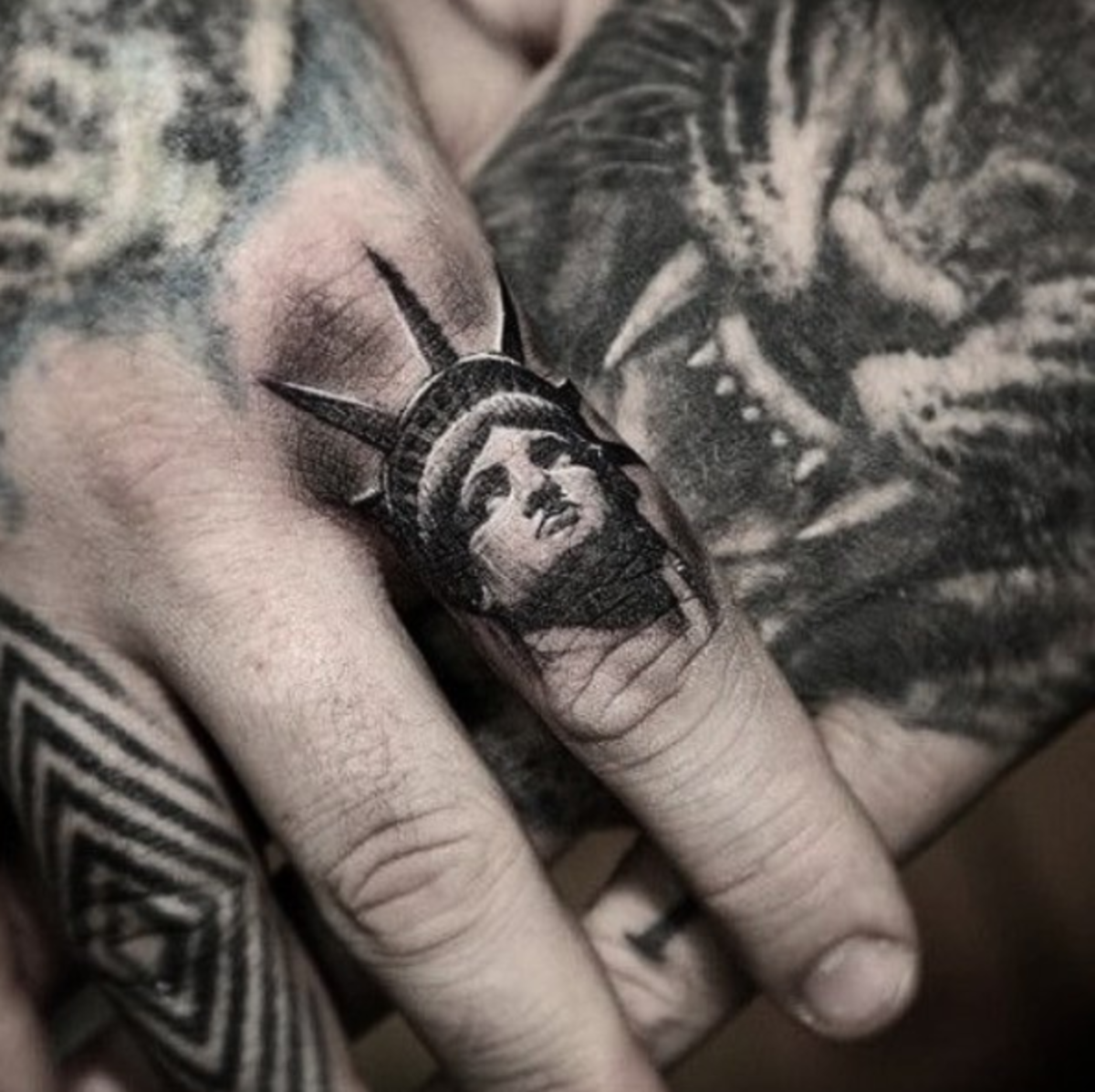 Statue-of-Liberty-finger-tattoo-Stefanos-Tattoos-Gallery-Pain-Magazine