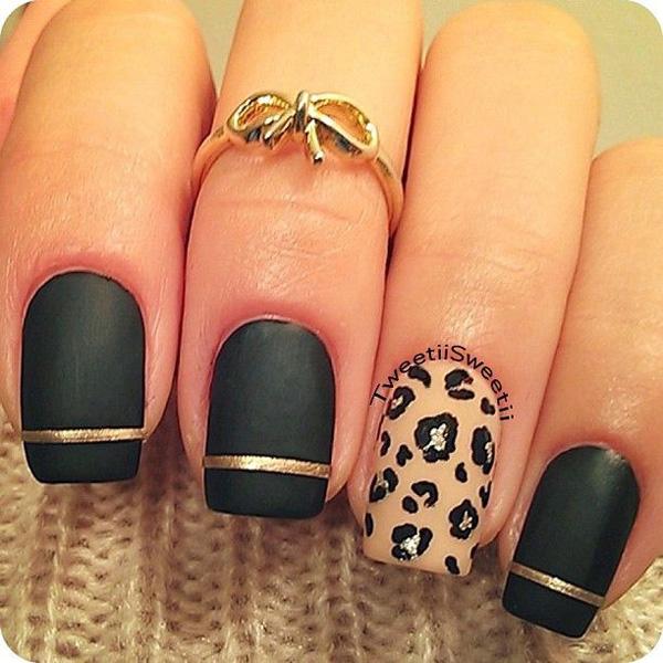 Maniküre in Schwarz und Leopard-Metallic