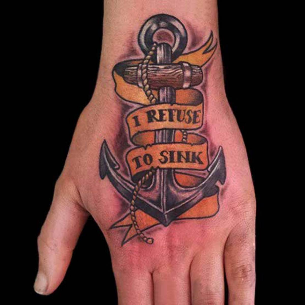 in-weigern-to-sink-anker-tattoo-auf-linker-hand
