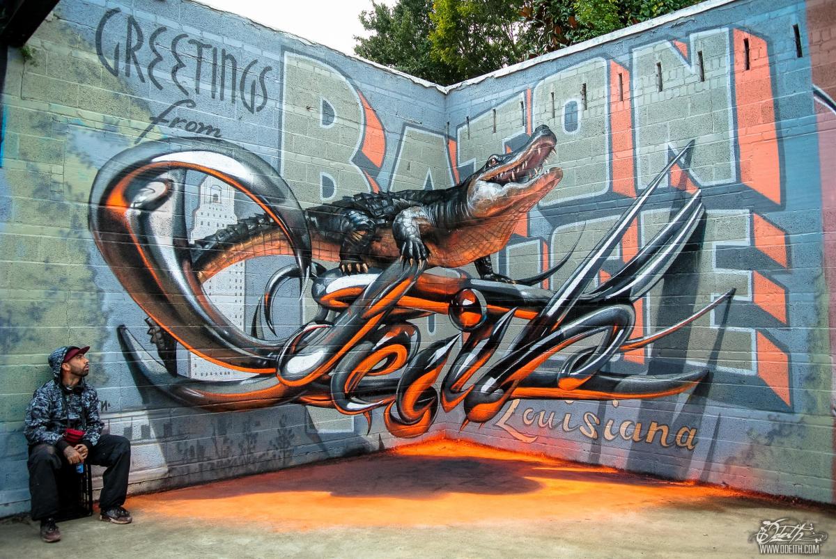 Odeith aligator stading on anamorphic 3d chrome letter تحية من باتون روج